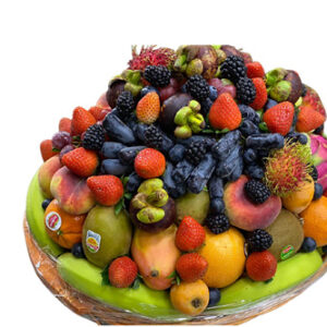 Fruits in round basket with berries